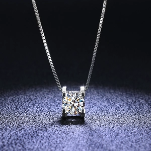 Macro shot of 925 sterling silver moissanite pendant with classic four-prong square setting