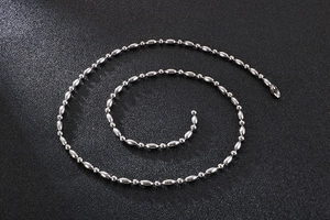 Detailed view of silver stainless steel ball chain with polished metallic finish