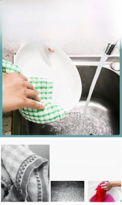Detail showing green checkered cotton kitchen towel with fiber texture and water absorption