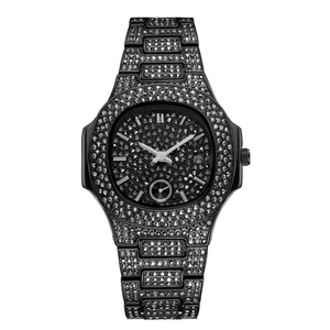 Detailed macro view of the full black iced-out watch dial with calendar window and crystals