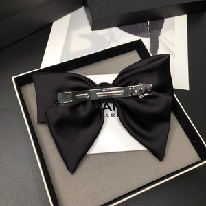 Elegant large black satin bow barrette in a premium gift box for women