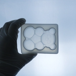 Detailed view of a semi-transparent bear silicone mold for 3D resin casting and DIY crafts