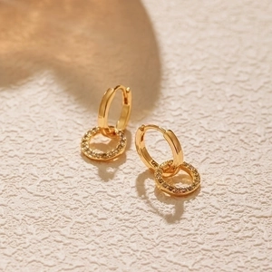 Elegant gold double hoop earrings with micro-pave cubic zirconia on textured stone