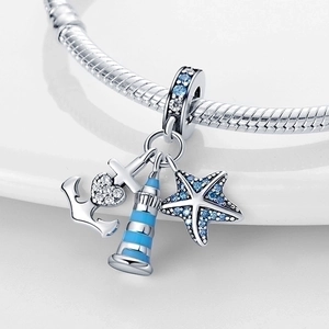 Marine charm set with blue starfish, lighthouse and anchor on silver snake chain