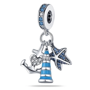 Detailed close-up of nautical charms featuring a starfish, anchor, and lighthouse with blue gems