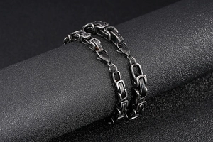 Detailed macro view of vintage Byzantine stainless steel chain bracelet with lobster clasp