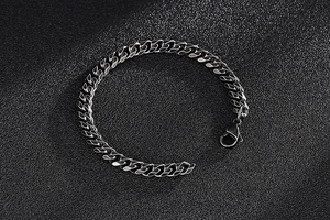 Detailed view of silver stainless steel curb link chain with a lobster clasp closure