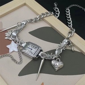 Y2K punk silver chain watch necklace with star and heart charms in a retro aesthetic