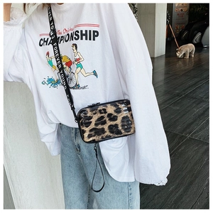 Detail of leopard print mini suitcase bag with Forever Young nylon crossbody strap