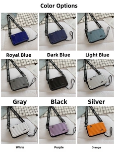 Mini suitcase-style crossbody bag grid view in nine colors with striped hard shell texture
