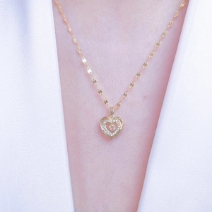 Gold plated stainless steel heart pendant necklace with zircon stone on model neck