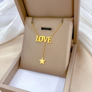 Minimalist gold titanium steel necklace with LOVE letters and star pendant in a gift box