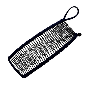 Detail of black banana hair clip with metal wires, elastic bands and decorative beads