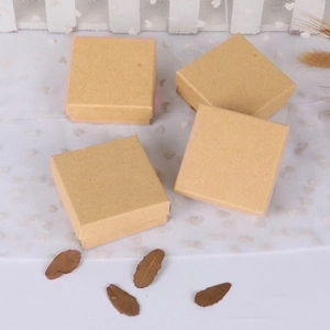 Set of four square kraft paper jewelry gift boxes for rings and earrings on white mesh