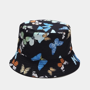 Detailed close-up of colorful butterfly prints on a black cotton reversible bucket hat