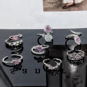 Elegant adjustable pink zircon ring set with heart and star charms on mirror surface