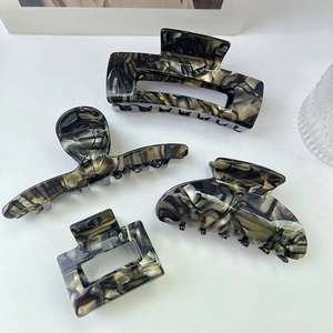 Chic 4-piece hair claw clip set with marble acetate patterns in luxury forest tones