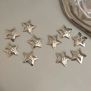 Set of 10 minimalist silver star-shaped metal hair clips in a stylish layout