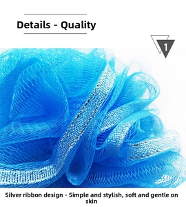 Macro detail of blue soft bath sponge with elegant silver trim and dense foaming mesh