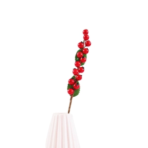 Artificial red berries in white ceramic vase for Christmas home decoration and festive gifts