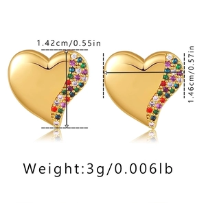 Macro shot showing dimensions of heart earrings with colorful zircons and gold finish