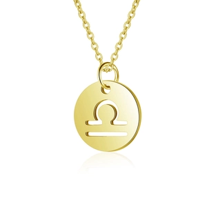 Detailed close-up of golden stainless steel Libra zodiac sign pendant necklace