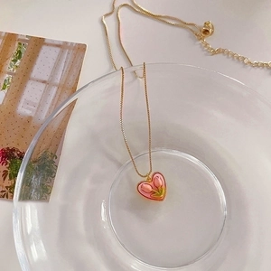 Pink tulip heart necklace in gold finish with a delicate chain for a romantic look