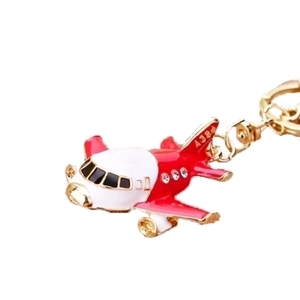 Sparkling airplane keychain with crystals and A380 detail on a clean white background