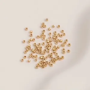 Macro shot of 1.6mm 14K gold plated brass tube beads for DIY jewelry making projects
