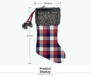 Detail view of plaid Christmas stocking with grey faux fur cuff and pom-poms, 47cm height