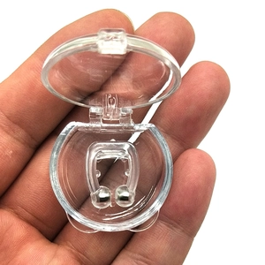 U-shaped magnetic anti-snoring nose clip in a transparent circular storage case