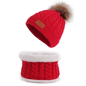 Red winter knit hat and neck warmer set with faux fur lining and large brown pompom