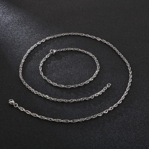 Polished silver stainless steel rope chain set with necklace and bracelet in studio light