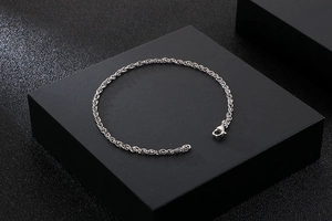 Silver stainless steel twist rope chain bracelet with lobster clasp on black display box