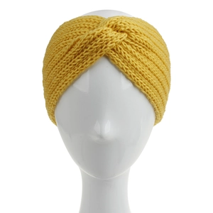 Close-up of a yellow knitted twisted headband on a white mannequin head for winter wear