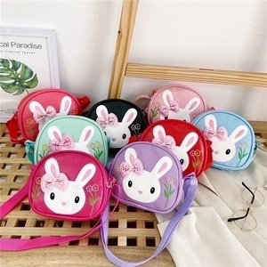 Collection of colorful cartoon rabbit shoulder bags in red pink and purple PU leather