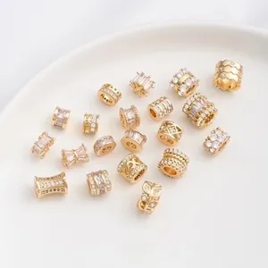 Macro detail of 14K gold plated spacer beads with micro-set zircon for DIY jewelry