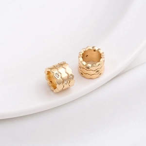 Detailed macro view of 14K gold plated honeycomb spacers with zircon micro-pave setting