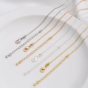 Detail of 14K gold-plated necklace chains with lobster clasps and teardrop extenders