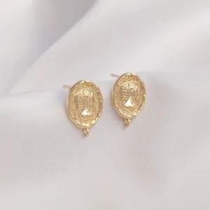 Macro view of 14K gold-plated queen cameo earrings with connection loops for DIY