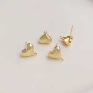 Detailed view of 14K gold filled 3D heart earring studs with open loops for DIY jewelry