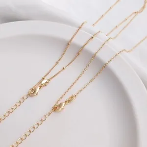 Detail of 14K gold plated flat O-chain necklace with adjustable extension and lobster clasp