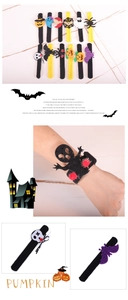 Detailed view of Halloween slap bracelets set featuring felt pumpkin and ghost icons