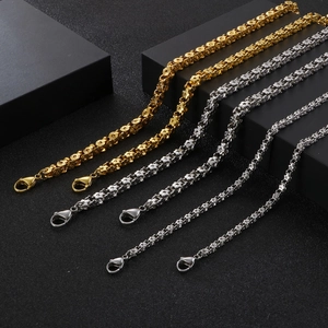 Mens stainless steel flower link chains in gold and silver finish on black background