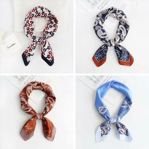 Four elegant printed silk-feel square scarves styled in bows with geometric patterns