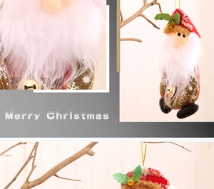 Detail of Santa gnome plush ornaments with metal bells hanging on a rustic branch