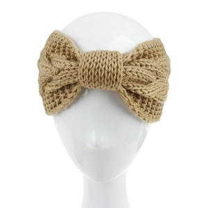 Close-up of khaki chunky cable knit headband with a stylish large bow design