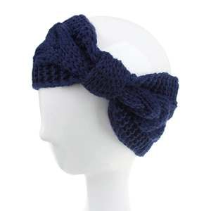 Detailed knit texture of dark blue twisted crochet headband on a model mannequin head