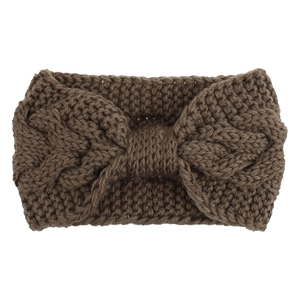 Detail of dark brown cable knit headband with a large bow design for ear protection