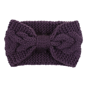 Detailed knit texture of dark purple winter headband with stylish bow knot feature